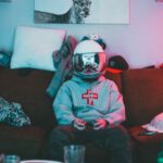 Virtual Reality And Augmented Reality - Boy in virtual reality helmet playing joystick