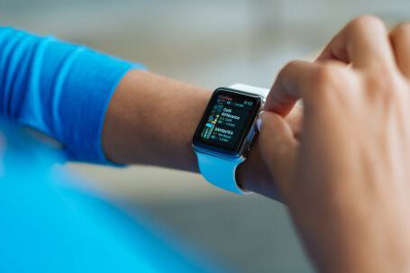 Smartwatch - Person in Blue Long Sleeve Shirt Using Smart Watch