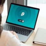 Cybersecurity - Woman Using Macbook Pro