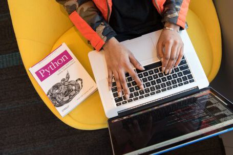 Software - Woman Programming on a Notebook