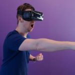 Virtual Reality - Man Punching in the Air while in VR Goggles