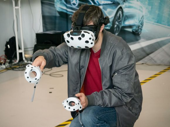 Virtual Reality And Augmented Reality - man in black jacket and blue denim jeans with white and black panda mask