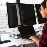 Coding - Woman Sitting in Front Laptop