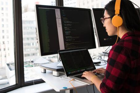 Coding - Woman Sitting in Front Laptop