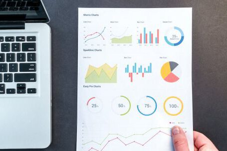 Analytics - Person Holding Chart And Bar Graph