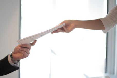 Career - Job Applicant Passing Her Documents