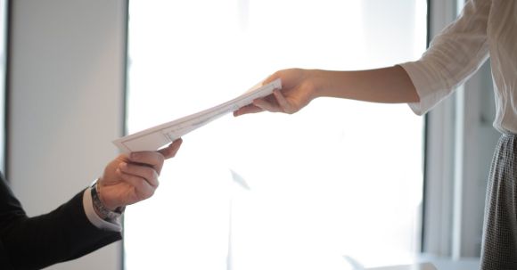 Career - Job Applicant Passing Her Documents