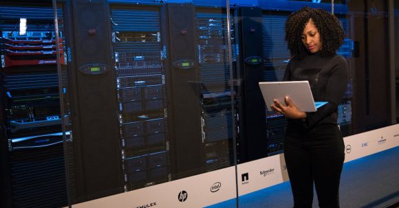 Server - Software Engineer Standing Beside Server Racks