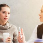 Career - Two Women Holding Pen