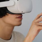 Virtual Reality And Augmented Reality - Amazed young man experiencing virtual reality in contemporary headset