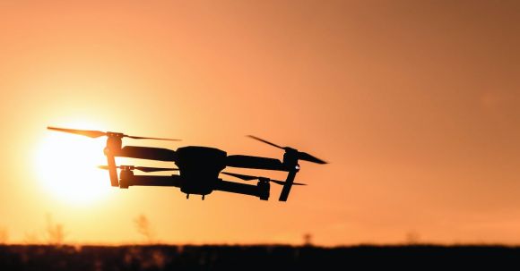 Quadcopter - Silhouette of Camera Drone Flew in Mid Air