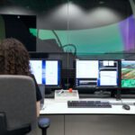 Software - Female Engineer Controlling Flight Simulator