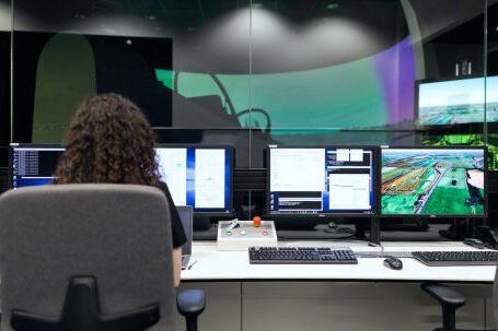 Software - Female Engineer Controlling Flight Simulator