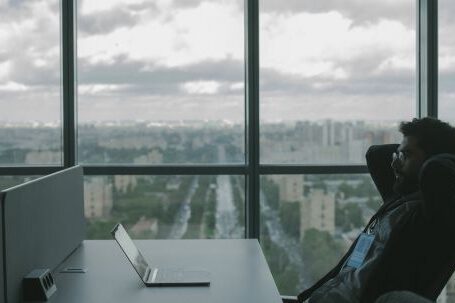 Cybersecurity - Man Reclining and Looking at his Laptop