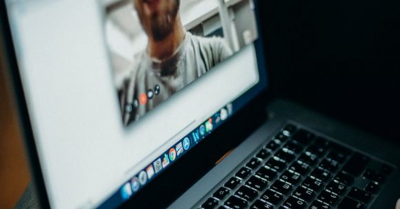 Video Conference - Turned-on Macbook