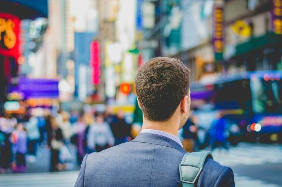 Career - shallow focus photography of man in suit jacket's back