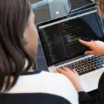 Coding - Two Women Looking at the Code at Laptop