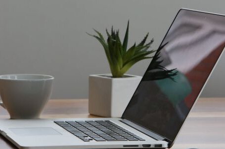 Technology - Silver Laptop and White Cup on Table