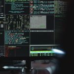 Cybersecurity - Close-Up View of System Hacking in a Monitor