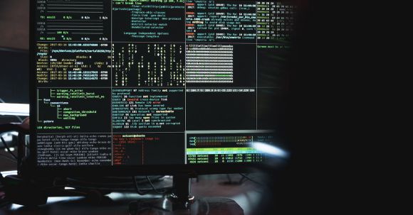 Cybersecurity - Close-Up View of System Hacking in a Monitor