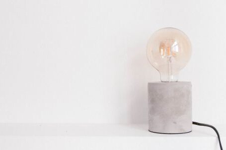 Technology - Light Bulb on White Panel