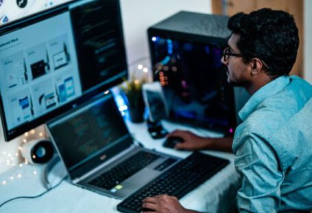 Pc - man in blue dress shirt using computer